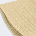 Bondi Washed Bucket Hat - A beige bucket hat with a textured fabric and a wide brim, featuring a logo on the side.
