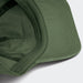 Vintage Washed Cap - A vintage washed cap in olive green with a structured brim and internal stitching details, featuring a logo.