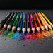 Staedtler Colouring Pencil Set of 12 - A set of 12 colouring pencils in various vibrant colours, arranged beside shavings of different hues.