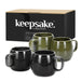 Keepsake Moda Coffee Mug – Set of 2 - A set of two coffee mugs in black and olive green, packaged in a box with a logo.