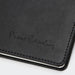 Pierre Cardin Fontaine Weekly Diary - 2027 - A black diary with a textured cover and embossed branding, featuring white stitching along the edges.