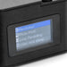 Candid Mini Camera - A small black camera featuring a display screen with menu options for settings like resolution and video timestamp.