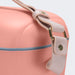 Daisy Cooler - A peach cooler bag with a light pink shoulder strap and a blue zip. It features a branded logo on the side.