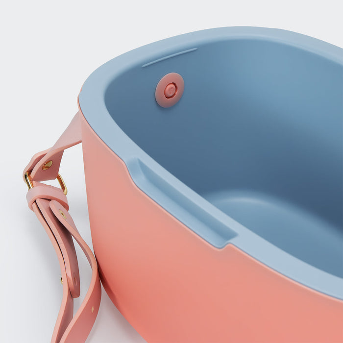Daisy Cooler - A drink cooler featuring a pink exterior and blue interior, with a handle and a fastening button.