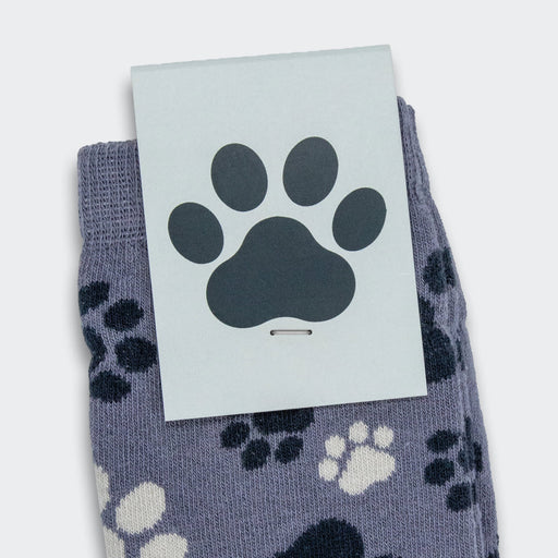 Jolly Knitted Kids Socks - A pair of knitted kids' socks in a purple-grey colour featuring a playful paw print design. Packaging has a paw badge.