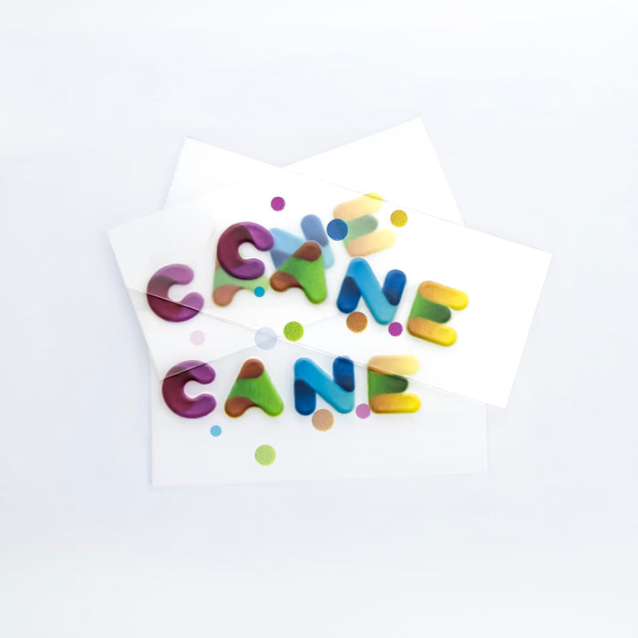 Prism Print - 78 x 48mm Sticker - Colourful, playful sticker letters in varying shades with polka dots on white backing paper.