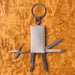 Multi-Tool Keyring - A metallic multi-tool keyring with various tools including scissors, a knife, and a screwdriver attached.