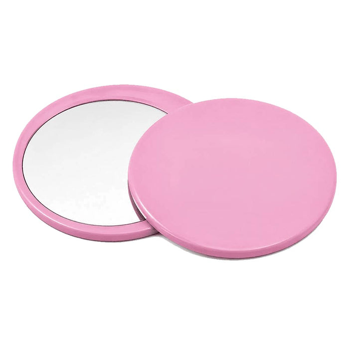 Glider slider makeup mirror - A pink circular makeup mirror with a smooth finish, featuring two sides—one reflective and one plain.