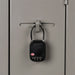 Atlas TSA Lock - A black TSA lock secured to a grey locker, featuring a combination dial and a small logo.