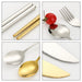 Travel Cutlery Set 4pcs - A stainless steel fork, spoon, and chopsticks in silver and gold, accompanied by a red tomato on a white background.