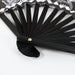 8inch Bamboo Fabric Hand Fan - An 8-inch bamboo fabric hand fan with a black wooden frame and decorative fabric design featuring shades of white and black.