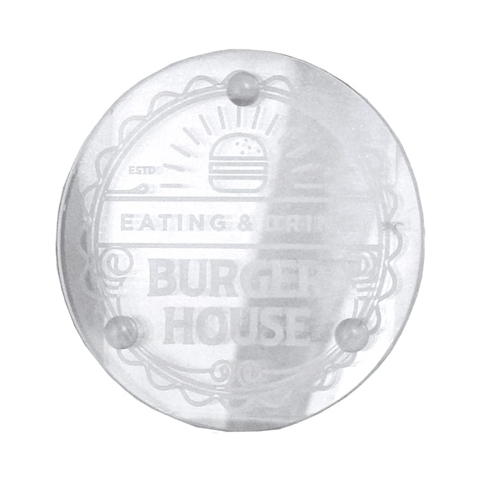 Round Glass Coaster - A clear round glass coaster with a logo design and four small feet for stability.