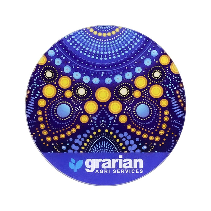 Round Glass Coaster - A round glass coaster featuring a vibrant purple and yellow dot pattern, with a logo at the bottom.