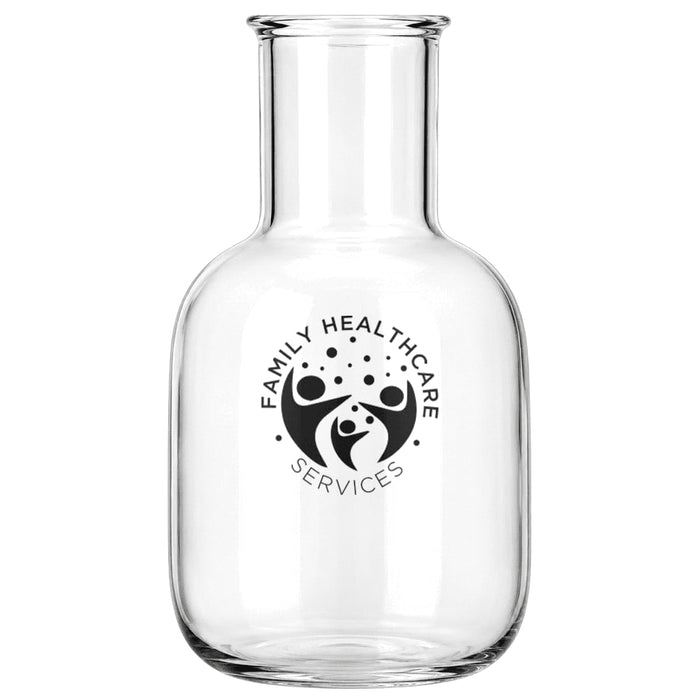 Amelie Glass Carafe & Cup Set 850ml - A glass carafe featuring a round body and a narrow neck, accompanied by a cup, both with a logo.