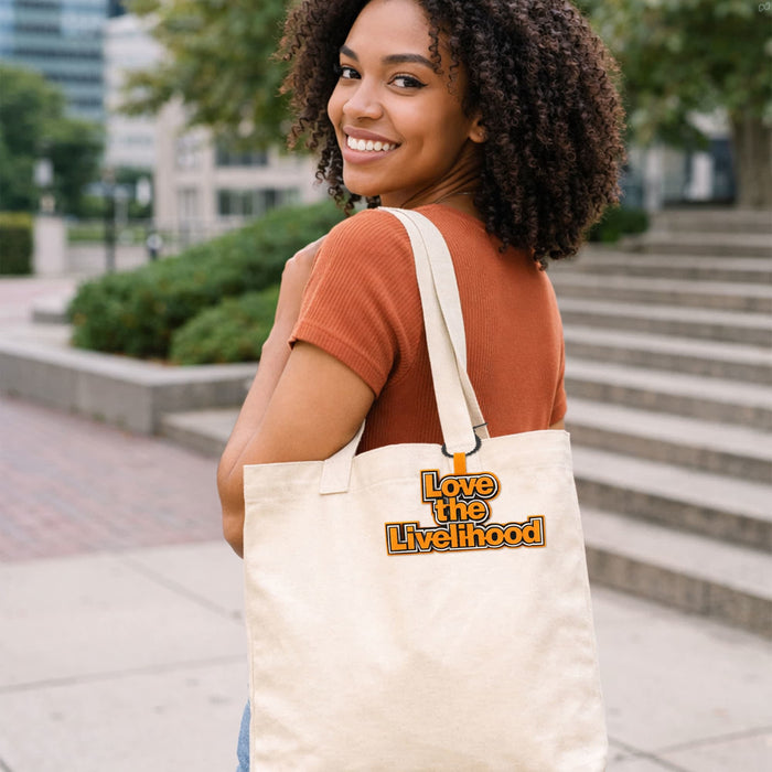 Custom Felt Logo Hanging Tag - A woman with curly hair smiles while carrying a cream-coloured tote bag with a logo.