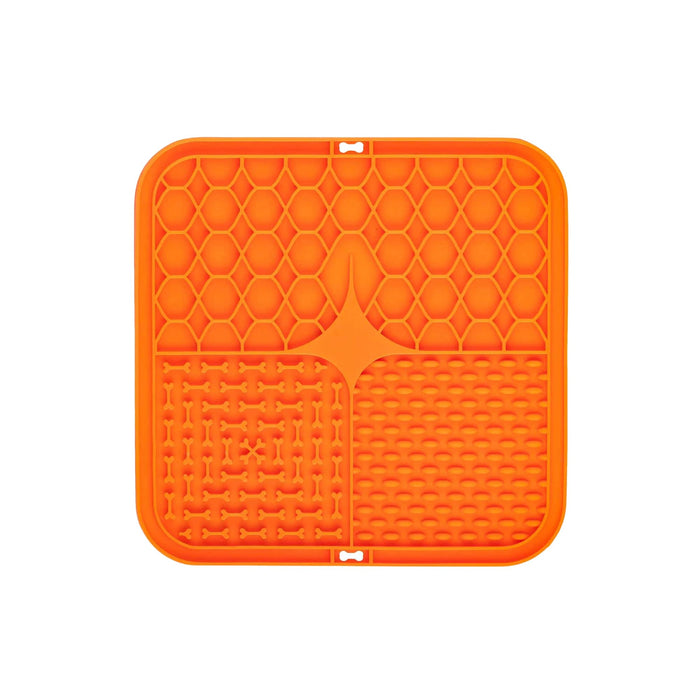 3-Section Dog Enrichment Lick Mat - An orange, square silicone lick mat featuring three textured sections: honeycomb, bone shapes, and grid patterns.