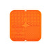 3-Section Dog Enrichment Lick Mat - An orange, square silicone lick mat featuring three textured sections: honeycomb, bone shapes, and grid patterns.