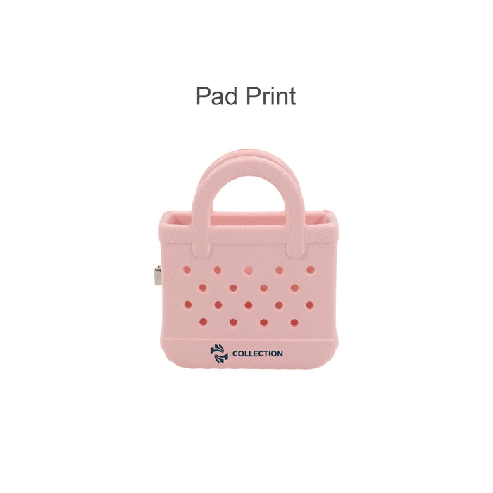 Mini EVA Holes Bag Clip - A pink mini EVA bag clip with a handle and perforated design, featuring a logo on the base.