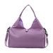 Duffle Bag With Yoga Mat Strap - A purple duffle bag with a yoga mat strap and a logo, featuring a unique design and a shoulder strap.