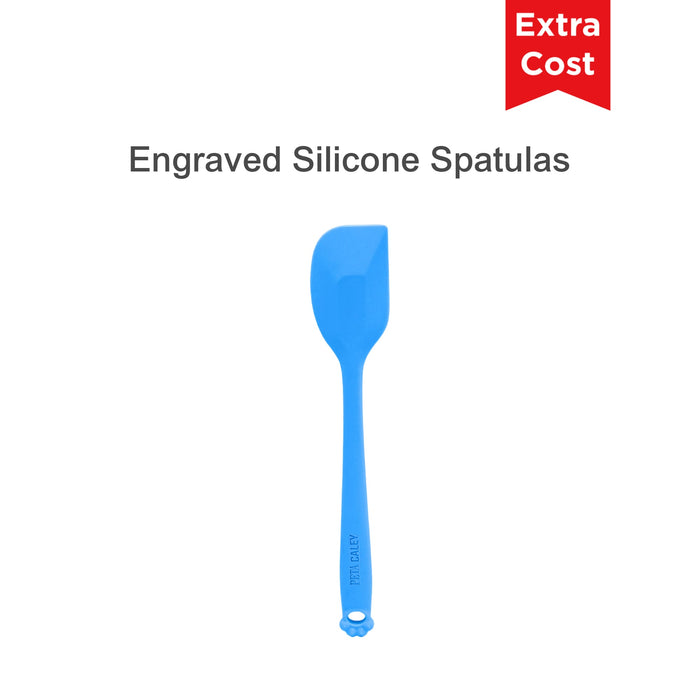 3-Section Dog Enrichment Lick Mat - A blue silicone spatula with an engraved handle, featuring a rounded end and a branding logo.