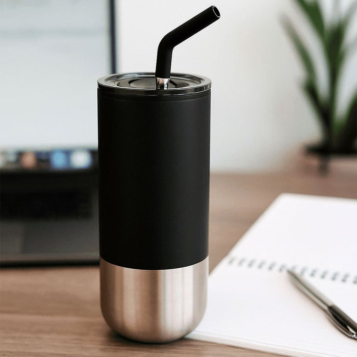 Lagom 470ml Tumbler w/ SS Straw - A drink bottle featuring a black matte finish and stainless steel bottom, with a black straw and a lid, beside a notebook and laptop.