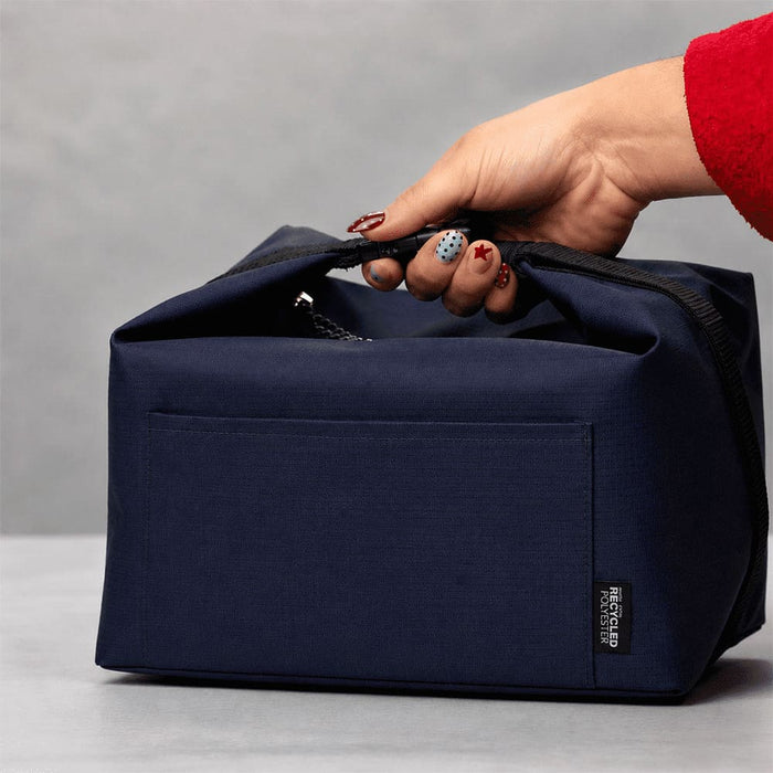 Caribou Drift Recycled 9 Can Lunch Cooler - A navy blue cooler bag with a handle, featuring a zipped top and a visible pocket on one side.