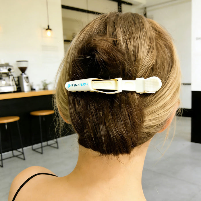 Anti-Slip Positioning Alligator Clip - A hair clip in white and yellow, styled in a person's hair, featuring a logo.