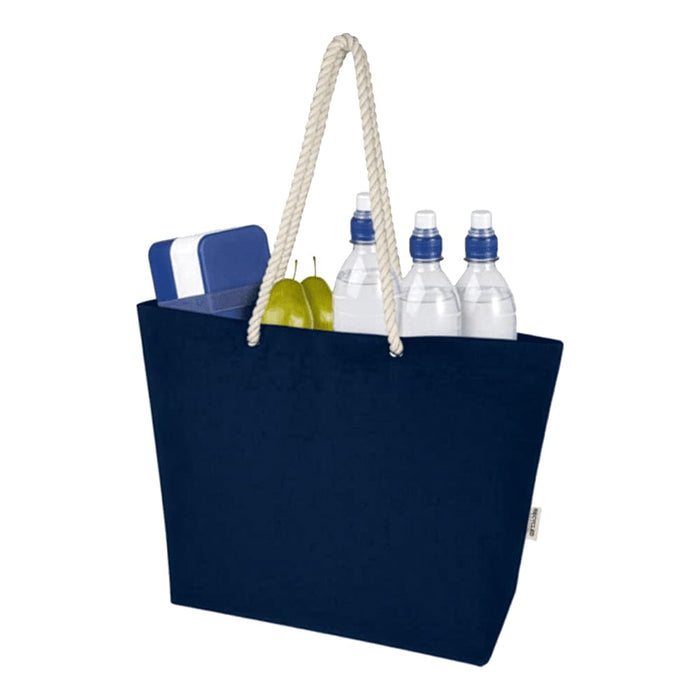 Florida GRS Recycled Beach Tote Bag - A navy blue tote bag with a rope handle, containing water bottles, a cooler, and two green pears.