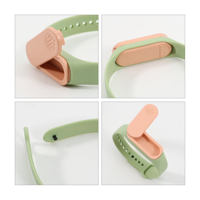 Medicine Box Wristband - A green and peach wristband with a removable compartment for storing medicine. Features a logo.