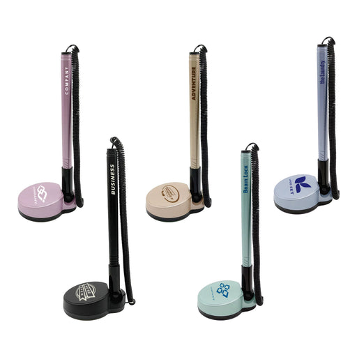 Counter Fixed Signature Pen D - A set of five fixed signature pens on stands, featuring pastel colours like pink, beige, and blue, with various branding.
