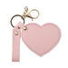 Heart-Shaped Compact Mirror with Keychain - A pink heart-shaped compact mirror with a gold keychain attachment. Includes a strap for easy carrying.