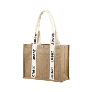 Custom Handle Jute Tote Bag - A jute tote bag in natural brown with cream-coloured handles featuring printed text and a snap closure.