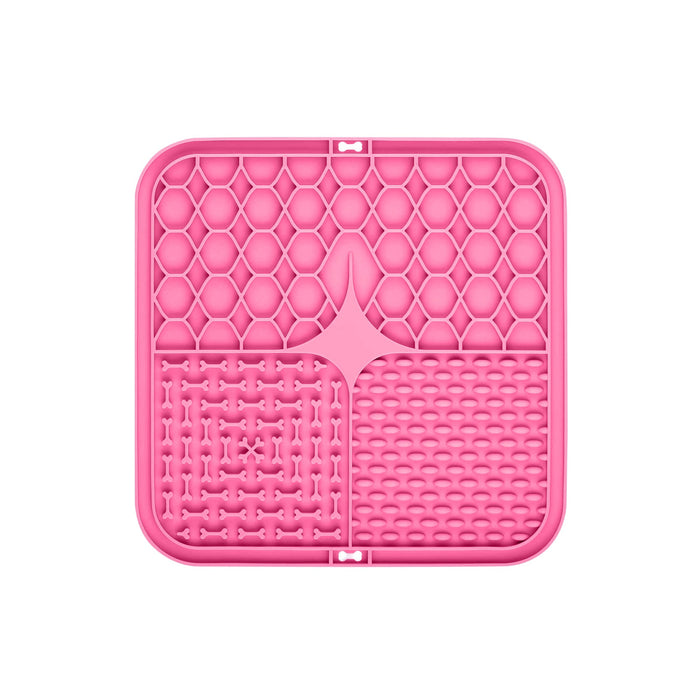 3-Section Dog Enrichment Lick Mat - A pink, three-section dog enrichment lick mat featuring various textured patterns for interactive play.