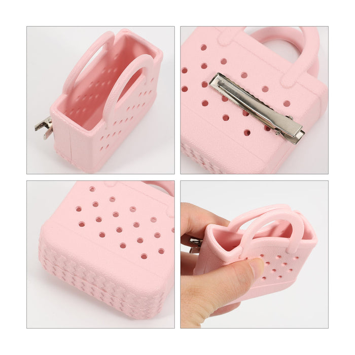 Mini EVA Holes Bag Clip - A pink mini EVA bag clip with a textured design and a metal clip, featuring a perforated surface and handle.