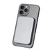 Quantum Pro Power Bank w/ Semi-Solid State Battery 5000mAh - A silver power bank attaches magnetically to the back of a grey smartphone, featuring a sleek design.