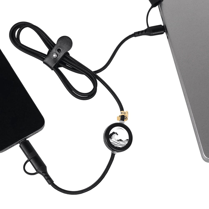 Night Mode Fast Charging Data Cable - A black charging cable with a circular connector, linking a device to a laptop, featuring a logo.