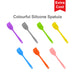 3-Section Dog Enrichment Lick Mat - A collection of colourful silicone spatulas in purple, grey, green, yellow, orange, and pink, featuring a logo.
