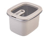Oasis Microwave Safe Rectangular S/S Container 500ml - A rectangular microwave-safe container in cream with a transparent lid and a metal rim, featuring a handle.