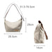 Dumpling Canvas Tote Bag - A beige canvas tote bag with a brown strap, featuring a logo, measuring 51.5–76.5 cm in length and 29 cm in height.