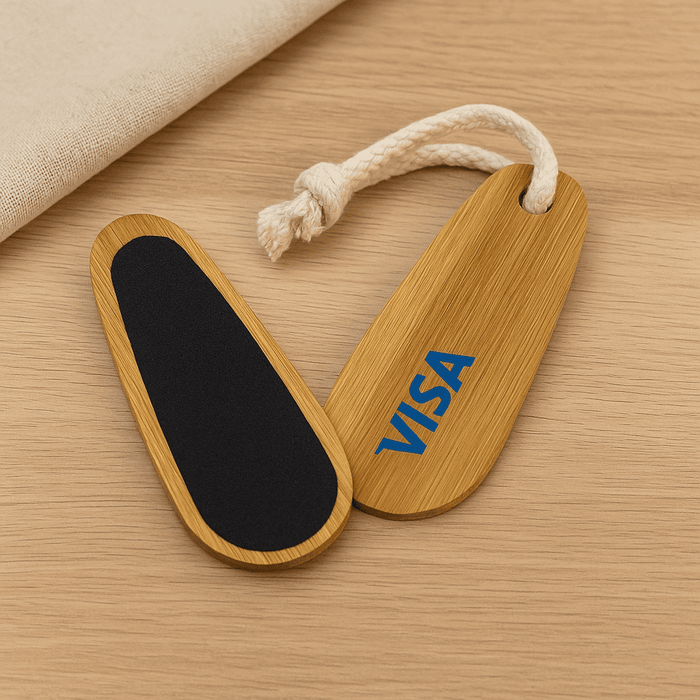 Bamboo Paddle Nail File - A bamboo paddle nail file featuring a black filing surface and a rope loop, with a logo on one side.