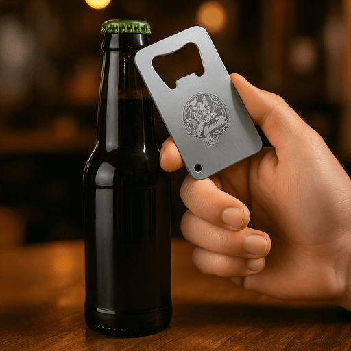 Stainless Credit Card Bottle Opener - A drink bottle opener resembling a credit card, made of stainless steel, held in a hand next to a dark bottle.