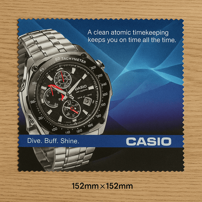 Medium Micro Fibre Cloth - A square cleaning cloth featuring a silver watch with a black face and a logo, set against a blue background.