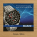 Medium Micro Fibre Cloth - A square cleaning cloth featuring a silver watch with a black face and a logo, set against a blue background.