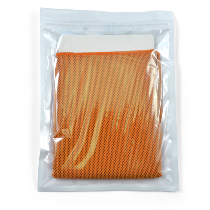 The Game Day Pack - An orange cooling towel neatly packed in a clear pouch, featuring a branding logo on the packaging.