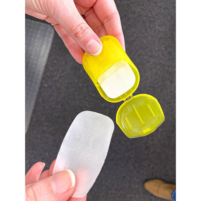 Soapy - A yellow container holding a translucent soap-like product, with the lid partially open.