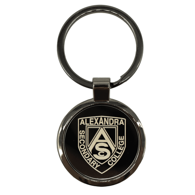 Anello Gunmetal Keychain - A gunmetal keychain featuring a circular design with a logo and a silver keyring attachment.