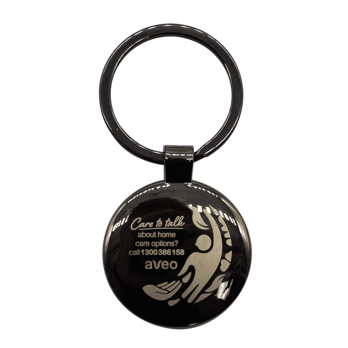 Anello Gunmetal Keychain - A gunmetal keychain featuring a circular shape and a design, with a branded logo.