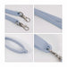 Silicone Cup Carry Strap - A drink bottle strap featuring a light blue silicone design with metal clips and textured grip.
