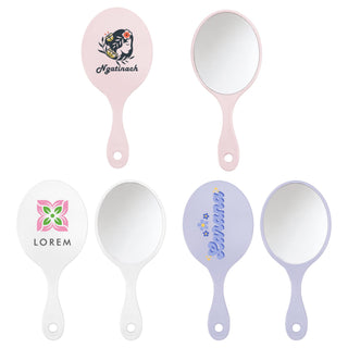 Chic Princess-Style Handheld Makeup Mirror - A handheld makeup mirror in pink and white featuring various designs, with a smooth reflective surface.