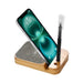 Apollo Eco 15W Wireless Charger Cable Kit - A wooden wireless charger with a grey fabric pad, holding a smartphone and a pen. It features a logo on the base.
